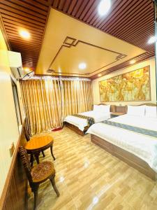 Ένα ή περισσότερα κρεβάτια σε δωμάτιο στο Dream House Homestay Hotel