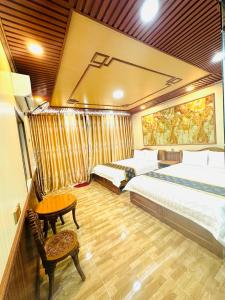 Giường trong phòng chung tại DREAM HOUSE Hotel