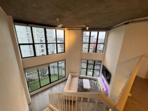 an overhead view of a room with large windows at LUXURY LOFT IN DOWNTOWN VANCOUVER in Vancouver
