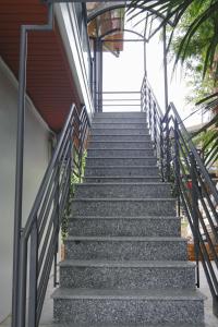 a set of stairs leading up to a building at Eroska Villa in Thôn Cát Lợi