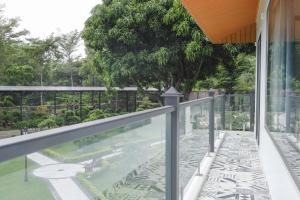 a swimming pool on the balcony of a house at Eroska Villa in Thôn Cát Lợi
