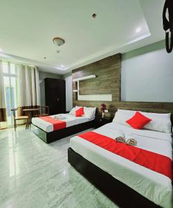 The JRJF Hotel near Tagum Terminal客房内的一张或多张床位