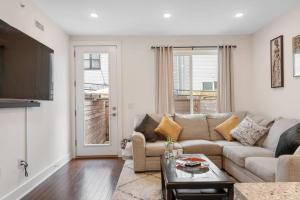 a living room with a couch and a table at Luxurious & Spacious 3Bed/3Bath with Outdoor Patio in Philadelphia