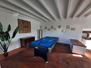 a room with a pool table in a room at La petite maison de Chavroches - proche du Pal in Chavroches