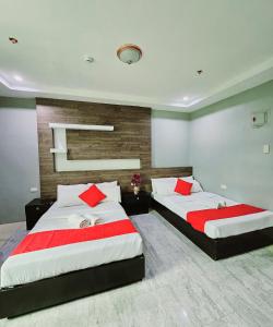 The JRJF Hotel near Tagum Terminal客房内的一张或多张床位