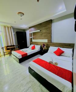 Postel nebo postele na pokoji v ubytování The JRJF Hotel near Tagum Terminal