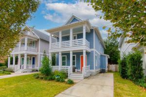a large blue house with a white porch at Shem Creek House- 5 Mins to Downtown & Beach in Charleston