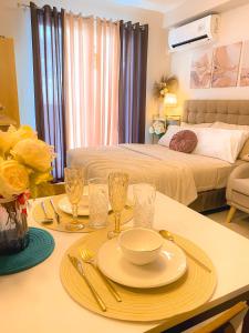 a table with a plate of food on it in a bedroom at Sea & City lights View in Lapu Lapu City