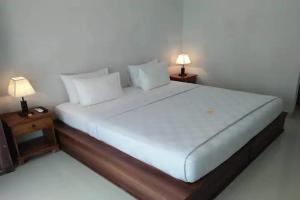 Postel nebo postele na pokoji v ubytování Taste of Bali Hostel
