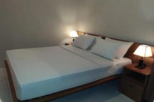 Postel nebo postele na pokoji v ubytování Taste of Bali Hostel