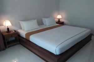 Postel nebo postele na pokoji v ubytování Taste of Bali Hostel