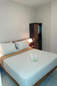 Postel nebo postele na pokoji v ubytování Taste of Bali Hostel