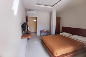 Postel nebo postele na pokoji v ubytování Taste of Bali Hostel