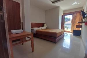 Postel nebo postele na pokoji v ubytování Taste of Bali Hostel
