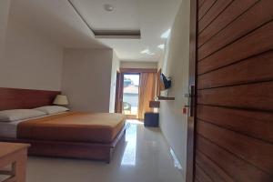 Postel nebo postele na pokoji v ubytování Taste of Bali Hostel