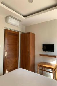 Postel nebo postele na pokoji v ubytování Taste of Bali Hostel