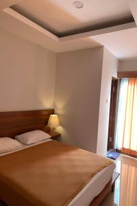 Postel nebo postele na pokoji v ubytování Taste of Bali Hostel