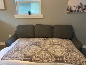 a bed in a room with a window at ATX Tiny House in Austin