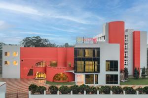a rendering of a building with a red facade at Ginger Durgapur in Durgāpur