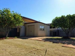 a house with a garage in a yard at Geelong Delight: Embrace Comfort @ Braund Avenue in Norlane