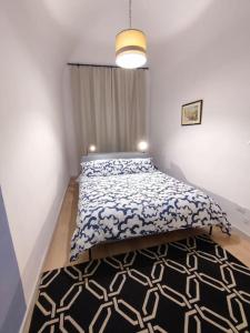 Cama o camas de una habitación en BiBiHome Catania appartamento in centro storico