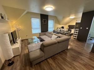 a living room with a couch and a table at Appartement Algo in Algolsheim