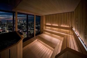 an empty sauna with a view of the city at The Royal Park Hotel Iconic Nagoya in Nagoya