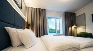 Postel nebo postele na pokoji v ubytování Go Hotel Herlev