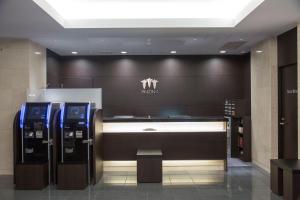 名古屋市にある三交イン名古屋伏見の建物内の自動販売機二台店