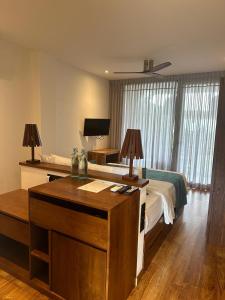 Ένα ή περισσότερα κρεβάτια σε δωμάτιο στο BK Beach Boutique Hotel - Hikkaduwa