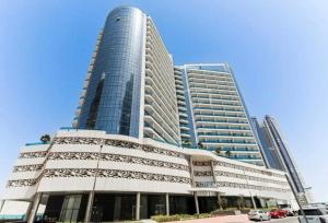 a large building with two tall buildings at Furnished 1 bhk in business bay in Dubai