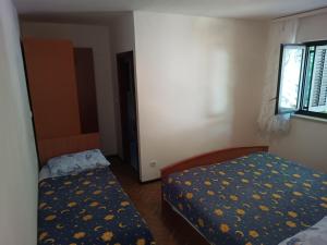 Postel nebo postele na pokoji v ubytování Apartments Gorenjka