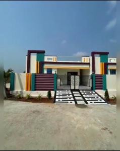 a house with colorful paint on it at Karthikeya villa’s in Narasaraopet