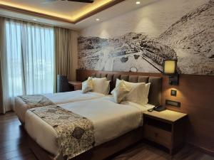 Ліжко або ліжка в номері Hotel Royal Lakshmi Palace