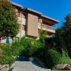 a building with stairs in front of a building at Hotel Etxeberri in Zumárraga