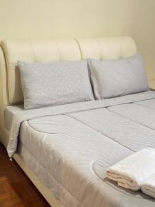 Postel nebo postele na pokoji v ubytování Stutong Stay