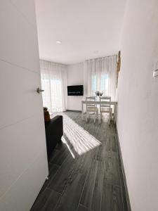 a living room with a table and a couch at Casa Mar y Montaña in Paterna de Rivera +54 photos