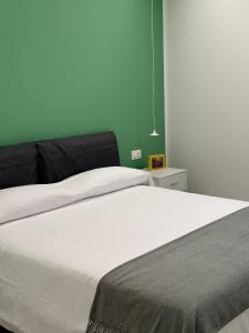 Posteľ alebo postele v izbe v ubytovaní La Vecchia Stazione Aci Castello