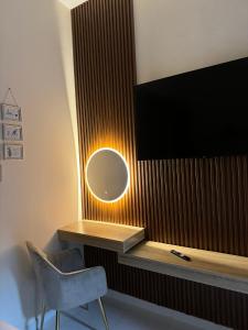 a room with a desk with a mirror and a tv at RksHome Studio Apartment Baniyas Metro Exit 2 in Dubai