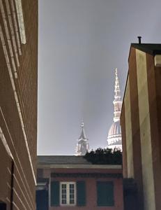 a view of a building with two towers in the background at Mille4 in Novara