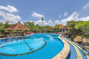 an image of a swimming pool at a resort at Santi Mandala Villa & Spa in Sukawati
