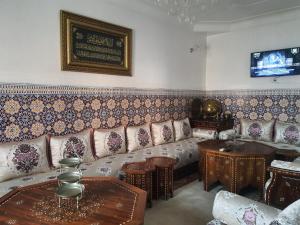 a living room with a couch and a table at Marrakech plus in Marrakech
