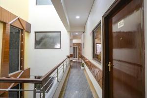 a hallway of a building with a door at FabHotel Spark Inn I in Gurgaon