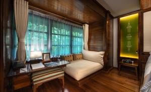 a room with a couch and a table and a window at Governor's Residence in Yangon