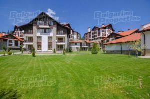a large lawn in front of a large building at BH and Semiramida Ski Apartment in Borovets