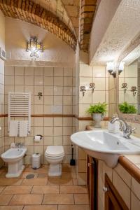 a bathroom with a sink and a toilet at DOMUS GELSOMINO in Rome