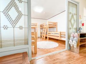 Postel nebo postele na pokoji v ubytování Empathy Guesthouse