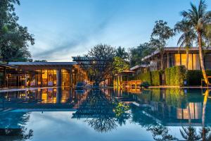 a hotel with a pool in front of a building at V Villas Hua Hin - MGallery Collection in Hua Hin +36 photos
