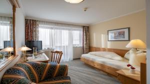 TV a/nebo společenská místnost v ubytování Hotel Andrea