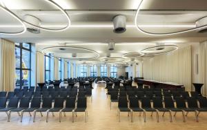 an empty conference room with chairs and tables at Hotel Vivendi in Paderborn